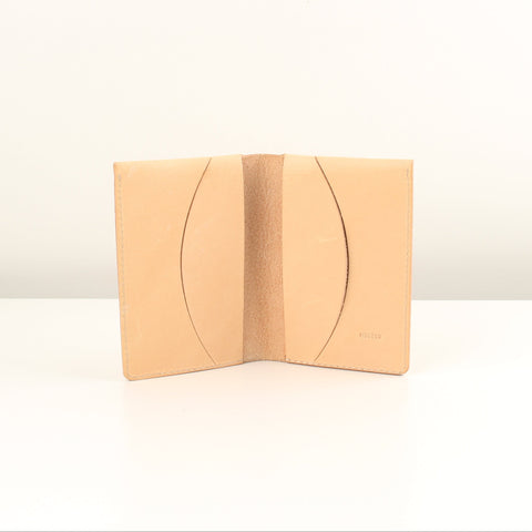 Beige leather wallet on a white background