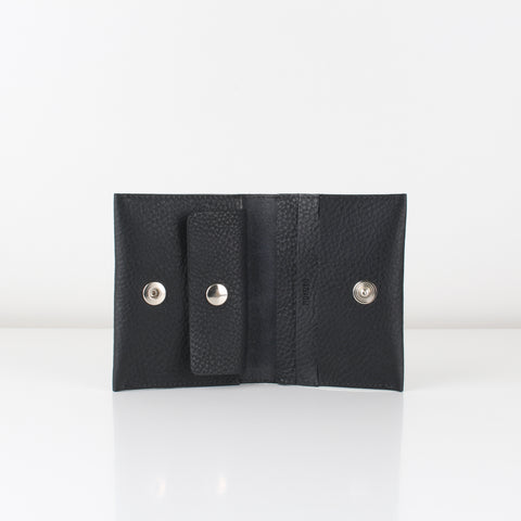 A closed black leather wallet with snap fastener closure and a coin compartment.