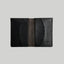 Black textured leather card wallet.