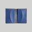 Blue leather cardholder on a light gray background