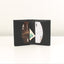 Black cardholder with cards and money on a white background